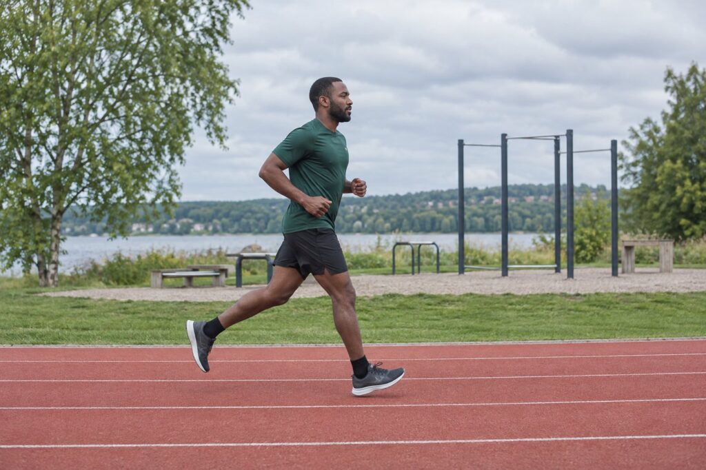 Adult running past an outdoor training area